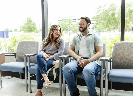 A young Latino couple wait together to get tested for HIV