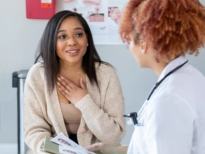 Young woman speaks to a nurse practitioner about HIV prevention